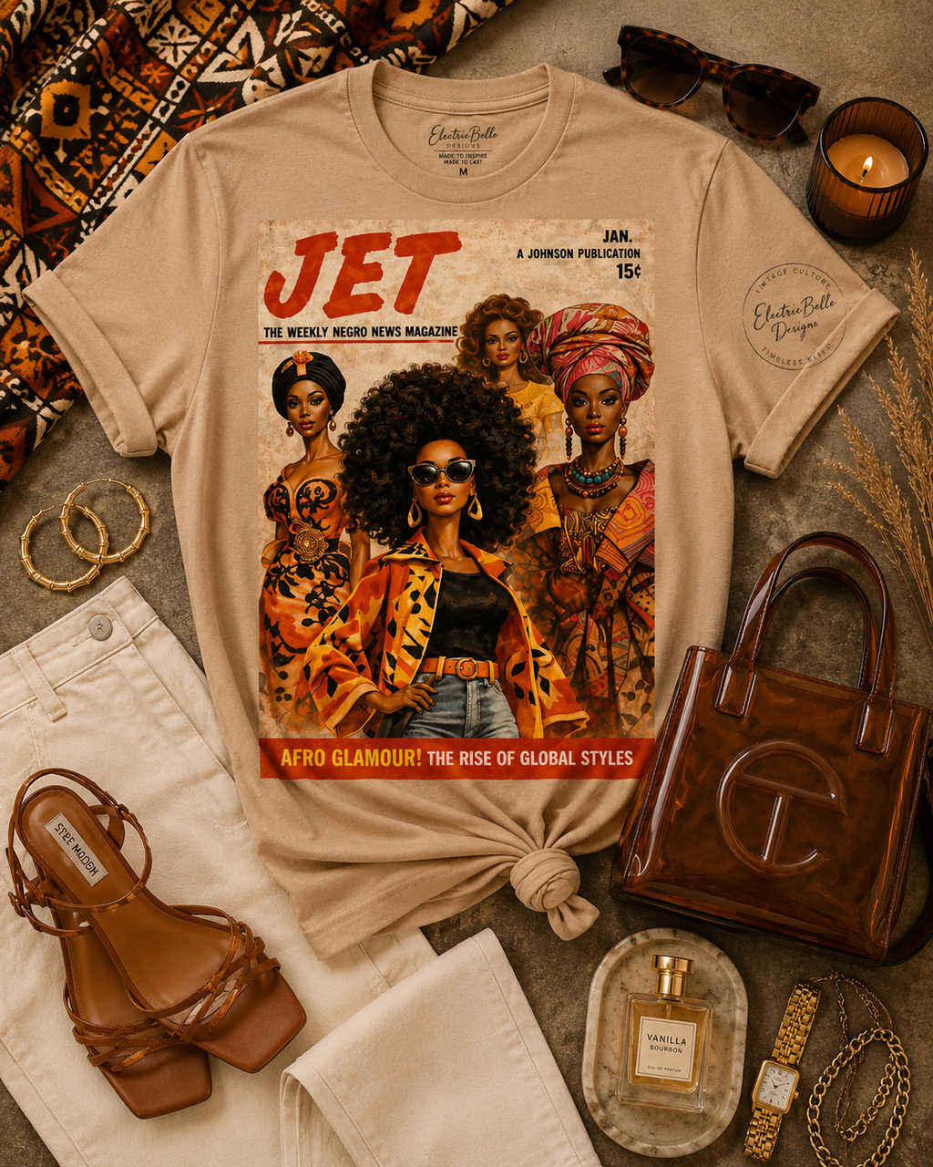 Tan Afro Glamour graphic tee styled with cream denim, brown strappy heels, a brown jelly bag, gold jewelry, tortoiseshell sunglasses and African print accents.